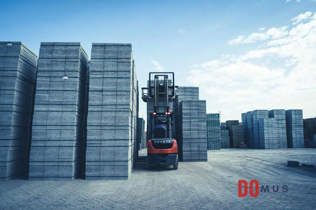 Forklift handling finished blocks in the stockyard